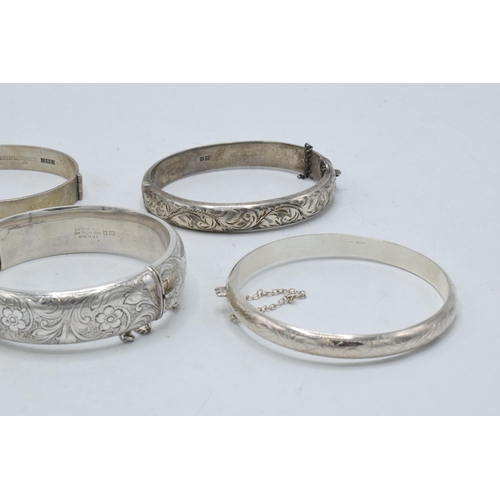 221E - A collection of 5 silver ladies bangles, 86.2 grams.