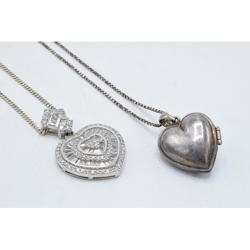 221G - A silver and paste heart pendant on silver chain together with a silver heart locket and chain (2).