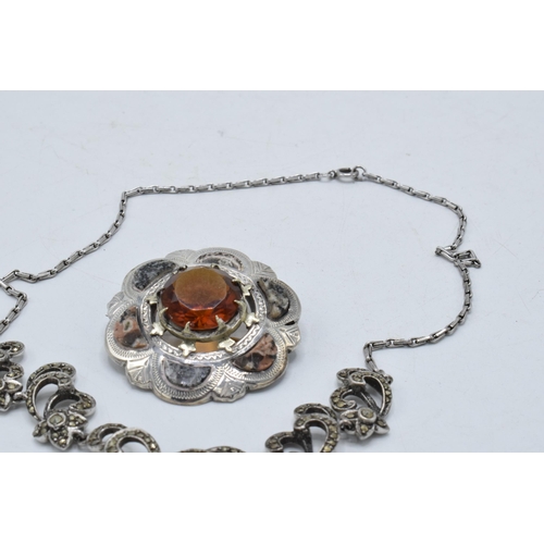 221H - A silver Scottish agate brooch (missing one section of agate) together with a silver marcasite neckl... 