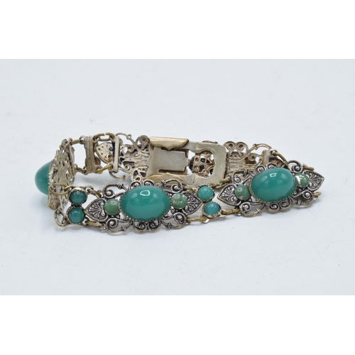 221J - Silver bracelet with green cabochon stones, 28.4 grams, 20cm long.