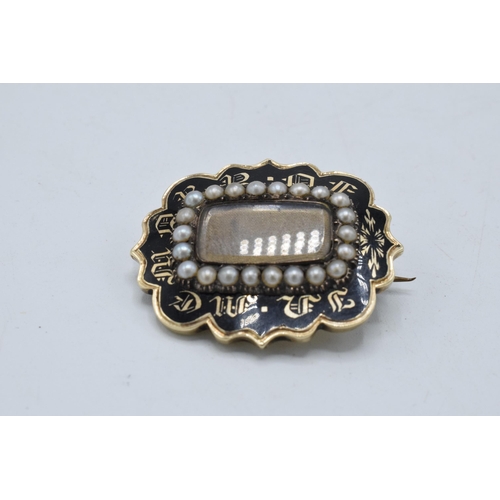 221O - Victorian gold mourning brooch set with pearls and black enamelling, gross weight 9.8 grams.