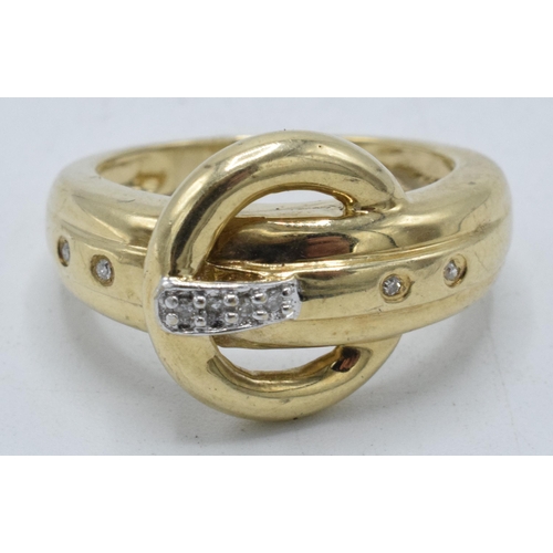 221R - 9ct gold and illusion-set diamond belt buckle ring, 3.9 grams, size L/M.