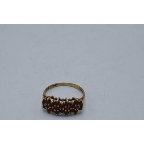 221U - 9ct gold ring set with semi precious stones, 2.1 grams, size P.