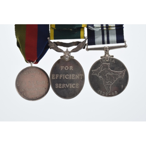 310F - A trio of World War Two medals to include silver India medal (CSM S E BAKER), 1939-1945 medal and Di... 