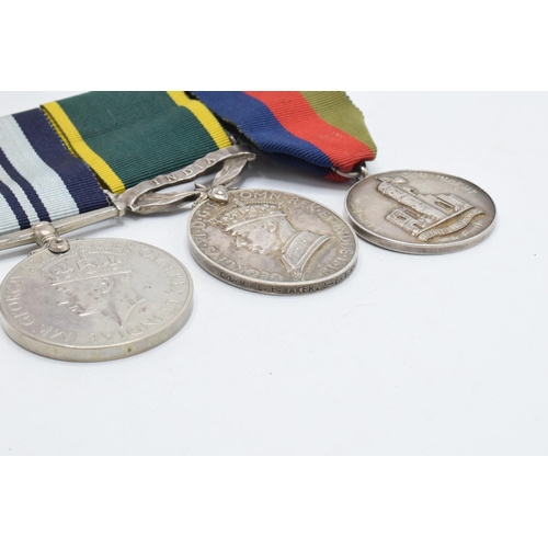 310F - A trio of World War Two medals to include silver India medal (CSM S E BAKER), 1939-1945 medal and Di... 