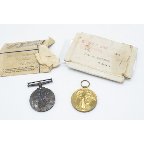 310I - A pair of World War One medals to include Victory medal and silver 1914-1918 medal with documents (2... 