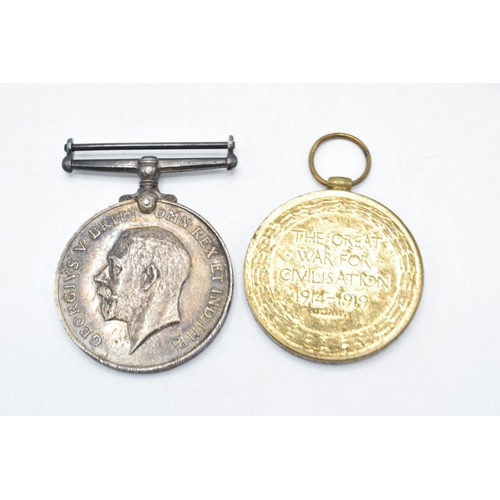 310I - A pair of World War One medals to include Victory medal and silver 1914-1918 medal with documents (2... 