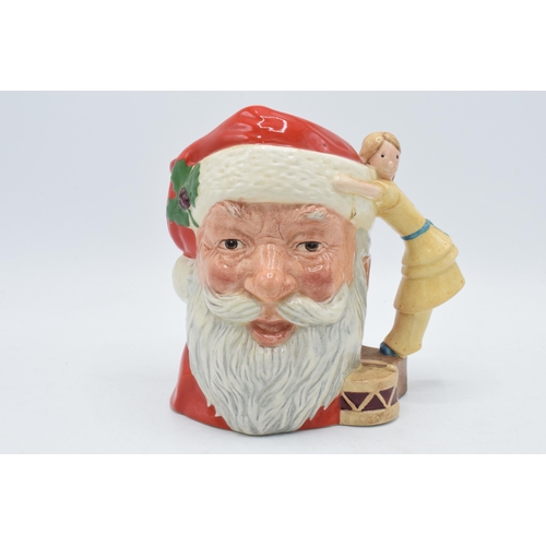 143 - Large Royal Doulton character jug Santa Claus D6668 with toy doll handle.