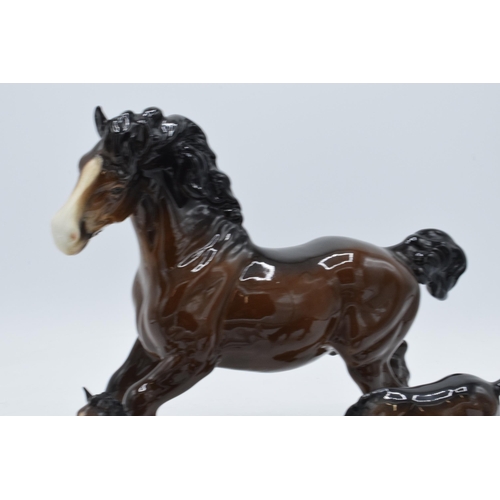 150 - A collection of Beswick horses to include brown cantering shire, brown outstretched foal, grey foal ... 