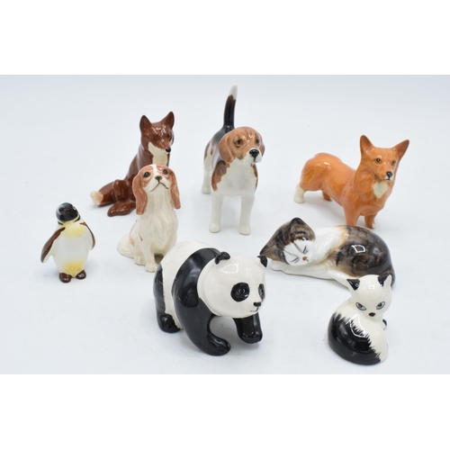 151 - A collection of Beswick animals to include penguin chick, panda, corgi, sitting fox, Royal Doulton c... 