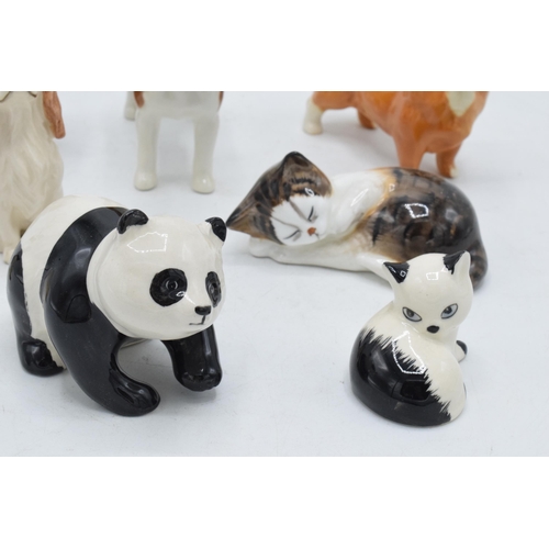 151 - A collection of Beswick animals to include penguin chick, panda, corgi, sitting fox, Royal Doulton c... 