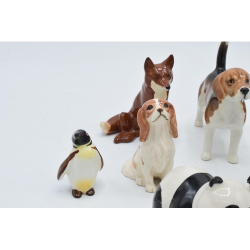 151 - A collection of Beswick animals to include penguin chick, panda, corgi, sitting fox, Royal Doulton c... 