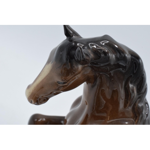 152 - Beswick horses to include brown stocky jogging mare 855, Shetland pony, head up pony and one other (... 