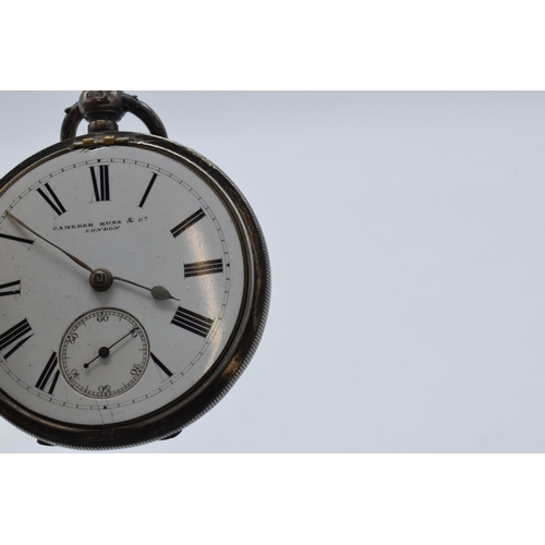 202 - A hallmarked silver pocket watch with replacement Perspex cover, Camerer Kuss & Co London.