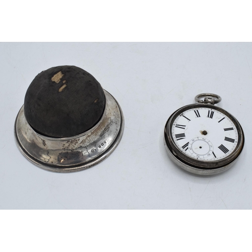 205 - A silver pin cushion and ring holder / trinket box, London 1921 together with a silver cased pocket ... 