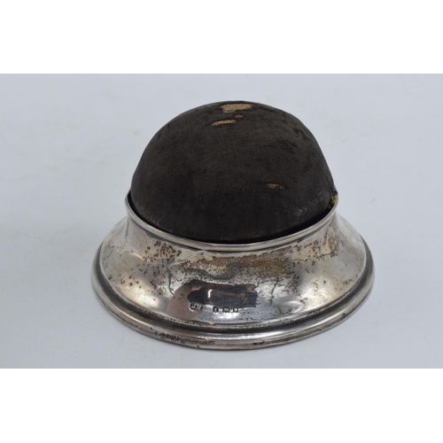 205 - A silver pin cushion and ring holder / trinket box, London 1921 together with a silver cased pocket ... 