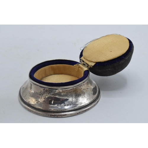 205 - A silver pin cushion and ring holder / trinket box, London 1921 together with a silver cased pocket ... 