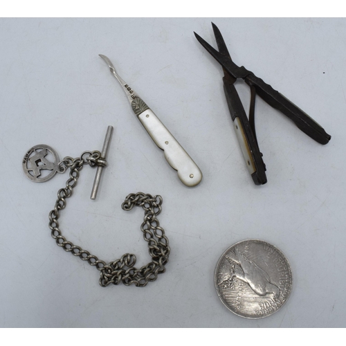 206 - A collection of silver items to include a silver Albert chain and hallmarked silver fob, silver 1922... 