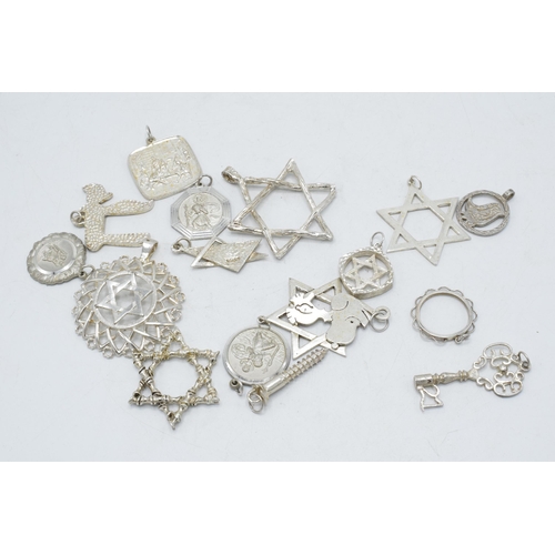 207 - A collection of silver and white metal jewellery items to include pendants such as stars, keys etc, ... 