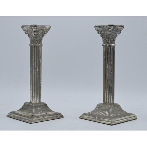 215 - A pair of vintage 20th century silver plated Corinthian column candlesticks, 21cm tall.