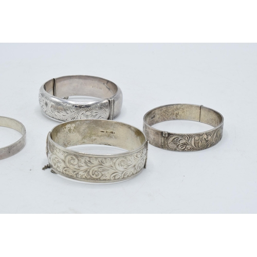 222 - 4 silver bangles of varying ages and forms (132.4 grams).