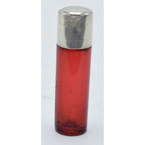 240 - Silver lidded cranberry glass bottle with original cork (silver unmarked). 6.5cm tall.