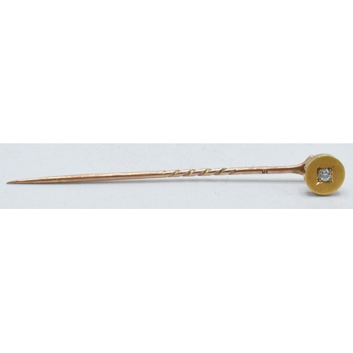 241 - Gold and diamond chip stick pin, 6cm long.