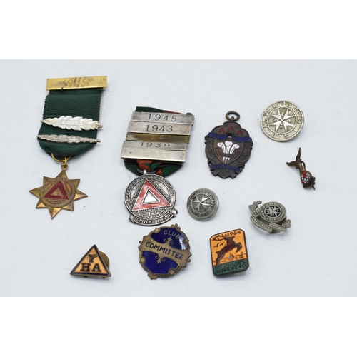 242 - A collection of vintage enamel badges, circa 1930s - 1950s, including silver safe driving medal with... 