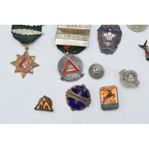 242 - A collection of vintage enamel badges, circa 1930s - 1950s, including silver safe driving medal with... 