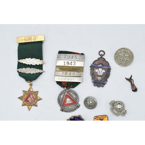 242 - A collection of vintage enamel badges, circa 1930s - 1950s, including silver safe driving medal with... 