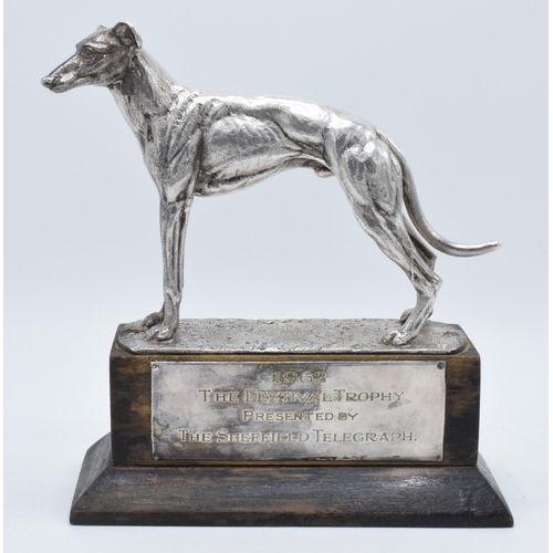 251 - A silver plated model of a realistically modelled greyhound on wooden base with matching plaque '196... 