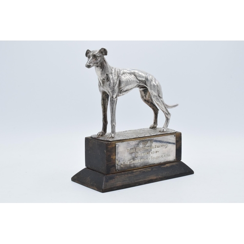 251 - A silver plated model of a realistically modelled greyhound on wooden base with matching plaque '196... 