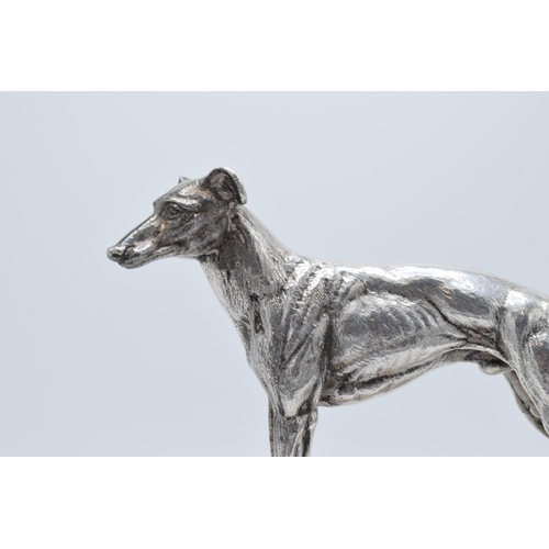 251 - A silver plated model of a realistically modelled greyhound on wooden base with matching plaque '196... 