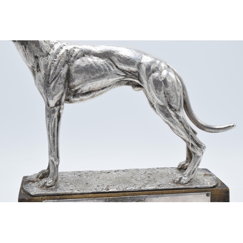 251 - A silver plated model of a realistically modelled greyhound on wooden base with matching plaque '196... 