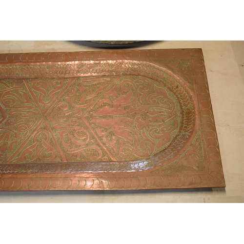 254 - An early 20th century heavy rectangular copper platter / tray with engraved decoration, thought to b... 