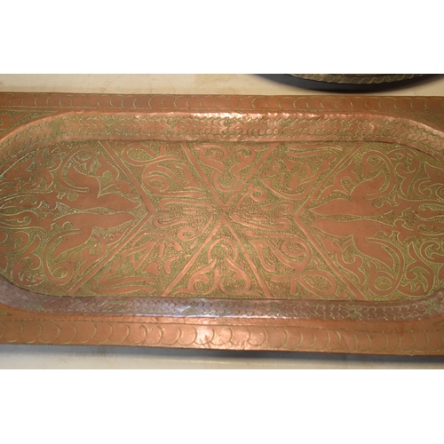 254 - An early 20th century heavy rectangular copper platter / tray with engraved decoration, thought to b... 