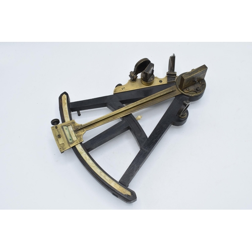 263 - A late 19th century nautical brass and ebonised wooden vernier sextant, unmarked, 31 x 25cm.