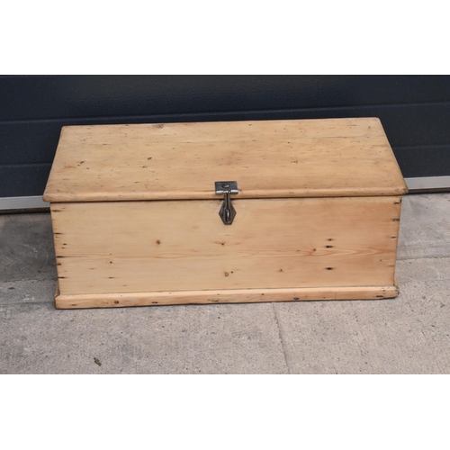 268 - A stripped pine blanket box with later industrial handles, 80 x 41 x 31cm tall.