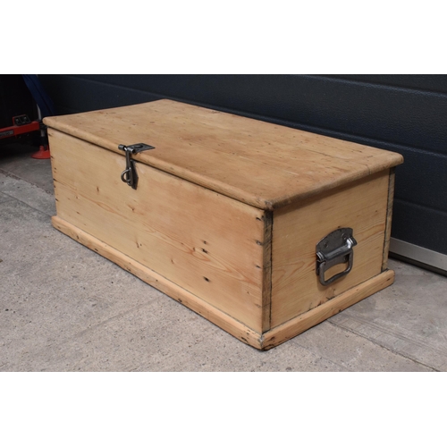 268 - A stripped pine blanket box with later industrial handles, 80 x 41 x 31cm tall.