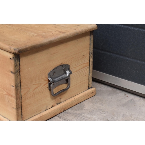 268 - A stripped pine blanket box with later industrial handles, 80 x 41 x 31cm tall.