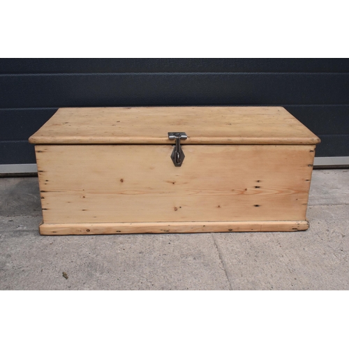 268 - A stripped pine blanket box with later industrial handles, 80 x 41 x 31cm tall.