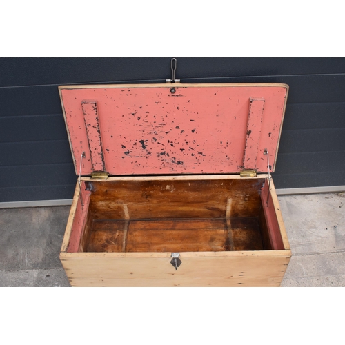 268 - A stripped pine blanket box with later industrial handles, 80 x 41 x 31cm tall.