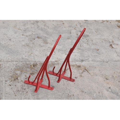 270A - A pair of vintage 20th century saddle / bridle hangers by Stubbs of England in a powder dip coated f... 