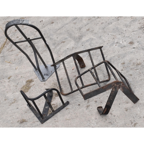 270B - A collection of vintage metal saddle / bridle hangers of varying forms (4).