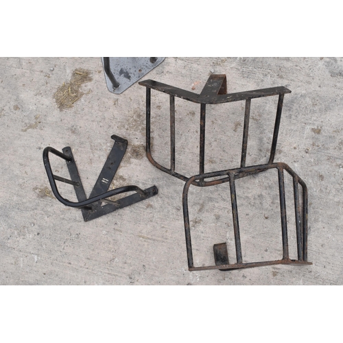 270B - A collection of vintage metal saddle / bridle hangers of varying forms (4).