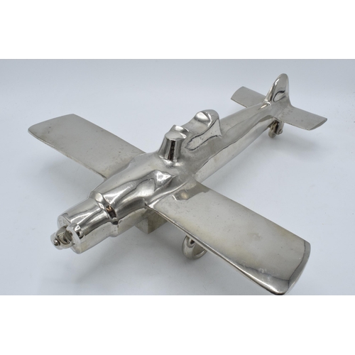 275 - Vintage 20th century nickel-plated cast metal model of a plane with rotating wheels and propeller, 4... 