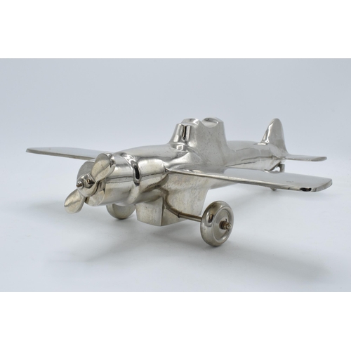 275 - Vintage 20th century nickel-plated cast metal model of a plane with rotating wheels and propeller, 4... 