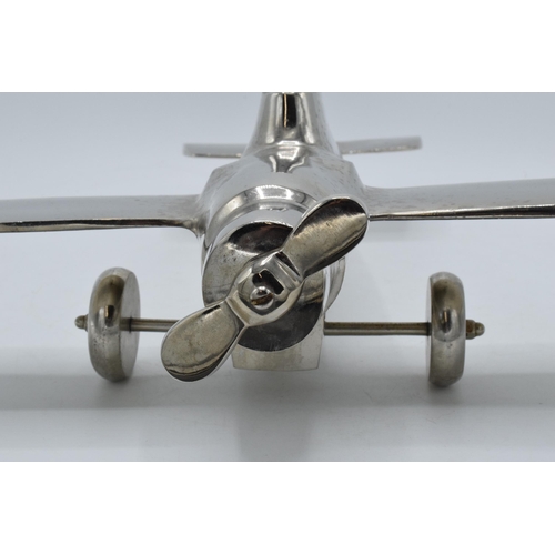 275 - Vintage 20th century nickel-plated cast metal model of a plane with rotating wheels and propeller, 4... 