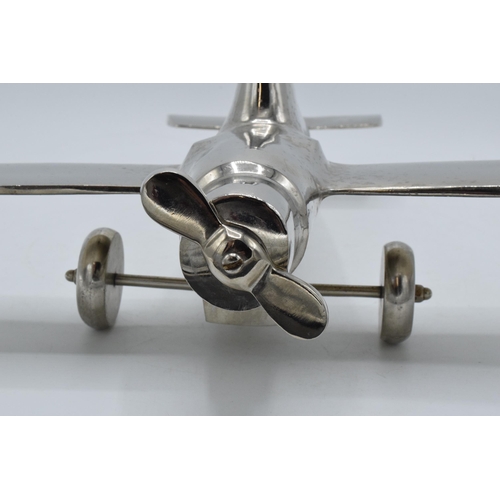 275 - Vintage 20th century nickel-plated cast metal model of a plane with rotating wheels and propeller, 4... 