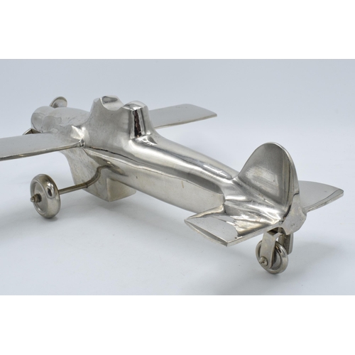 275 - Vintage 20th century nickel-plated cast metal model of a plane with rotating wheels and propeller, 4... 